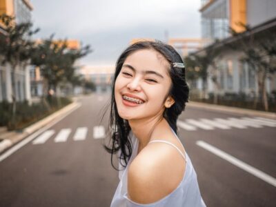 adult with braces smiling in Bakersfield