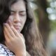 person with jaw and facial pain considering TMJ treatment in Bakersfield